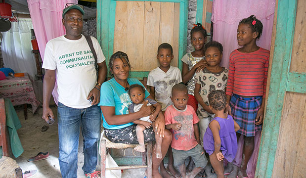 A community health worker visits a family who receives sustainable livelihood support.