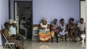 patients sit at the hospital, waiting to be seen. 